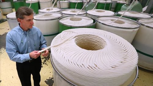 Buhler  Yarns  CEO Marty Moran looks over slivers used to spin yarn during a tour of his company on Monday, March 11, 2019, in Jefferson. Curtis Compton/ccompton@ajc.com