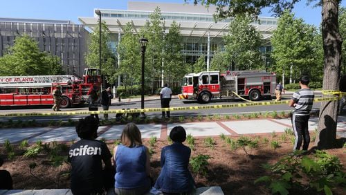 Firefighters responded to a building on the Georgia Tech campus Tuesday after a small explosion in a lab. The building was evacuated. (BEN GRAY / BGRAY@AJC.COM)