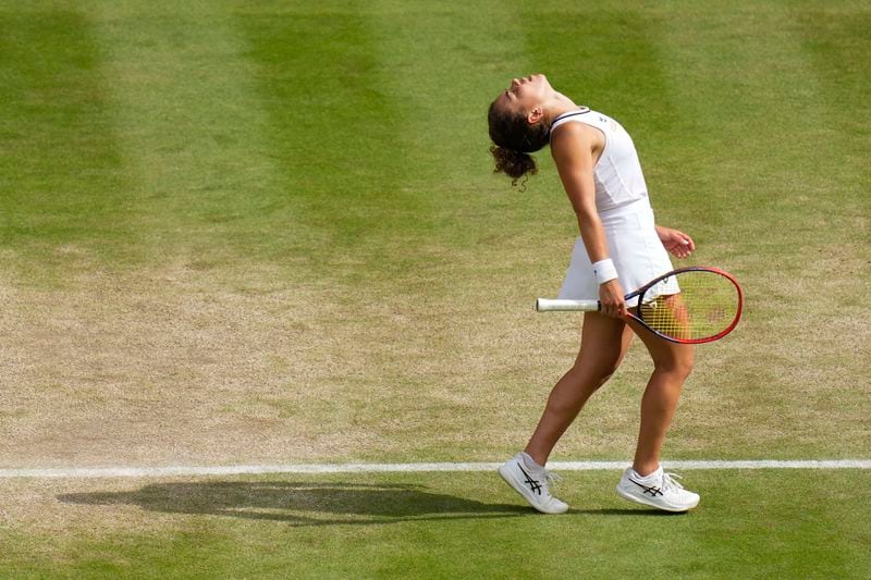 Jasmine Paolini of Italy reacts during her semifinal match against Donna Vekic of Croatia at the Wimbledon tennis championships in London, Thursday, July 11, 2024. (AP Photo/Kirsty Wigglesworth)