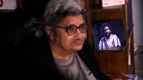 FILE - Laila Soueif, mother of jailed pro-democracy activist Alaa Abdel-Fattah, speaks during an interview with the Associated Press in front of his picture at her home in Cairo, Egypt, Thursday, Nov. 10, 2022. (AP Photo/Amr Nabil, File)