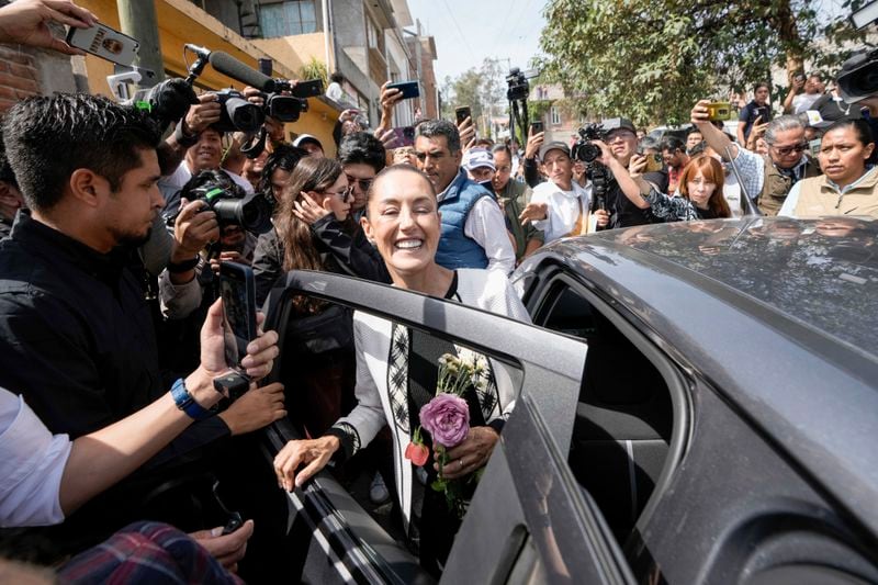 Ruling party presidential candidate Claudia Sheinbaum leaves the polling station where she voted during general elections in Mexico City, Sunday, June 2, 2024. (AP Photo/Eduardo Verdugo)