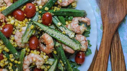 Skillet roasted okra, shrimp, corn and tomatoes on a bed of arugula.
(Virginia Willis for The Atlanta Journal-Constitution)