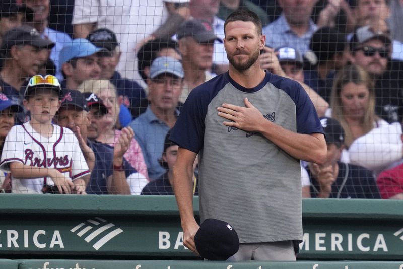 Atlanta Braves pitcher Chris Sale acknowledges Red Sox fans at the top of the second inning of a baseball game, Tuesday, June 4, 2024, at Fenway Park in Boston. Sale pitched for the Sox from 2017-2023. (AP Photo/Charles Krupa)