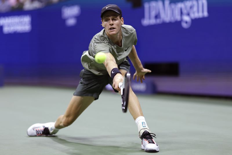 Jannik Sinner, of Italy, returns against Daniil Medvedev, of Russia, during the quarterfinals of the U.S. Open tennis championships, Wednesday, Sept. 4, 2024, in New York. (AP Photo/Adam Hunger)