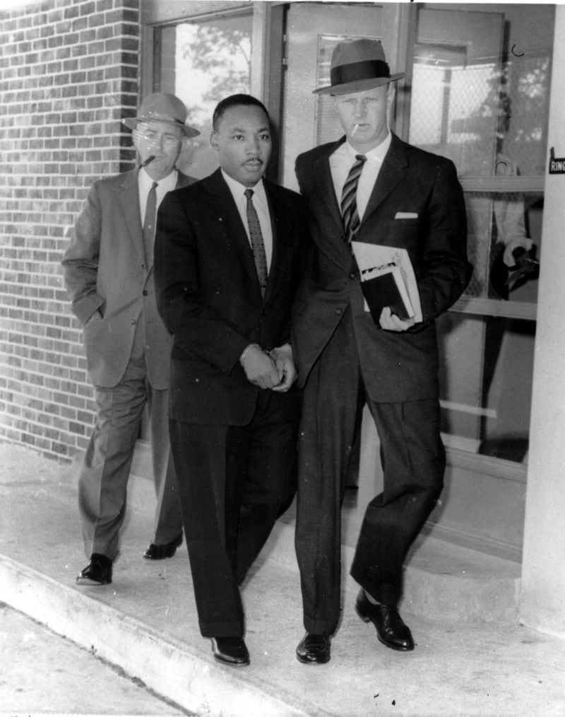 Martin Luther King Jr. is escorted from the Atlanta jail  to a DeKalb County courthouse on Oct. 25, 1960. (AP Photo, File)