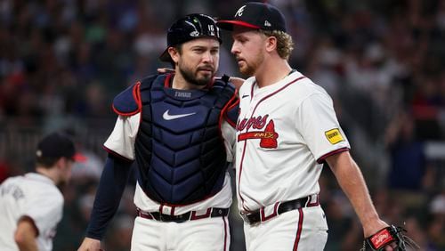 Atlanta Braves pitcher Spencer Schwellenbach, right, greets Atlanta Braves catcher Travis d'Arnaud after the end of the top of the seventh inning against the New York Mets at Truist Park, Tuesday, Sept. 24, 2024, in Atlanta. The Braves won 5-1. (Jason Getz / AJC)

