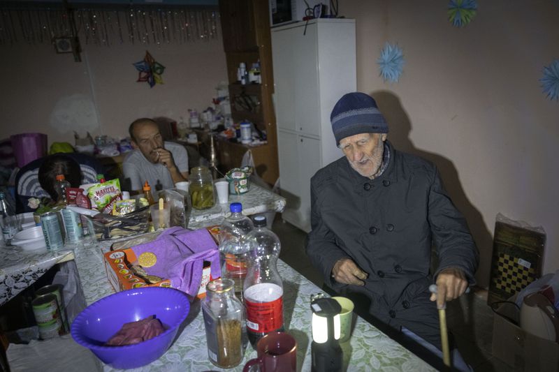 Local residents hide in a basement in Sudzha, Kursk region, Russia, Friday, Aug. 16, 2024. This image was approved by the Ukrainian Defense Ministry before publication. (AP Photo)