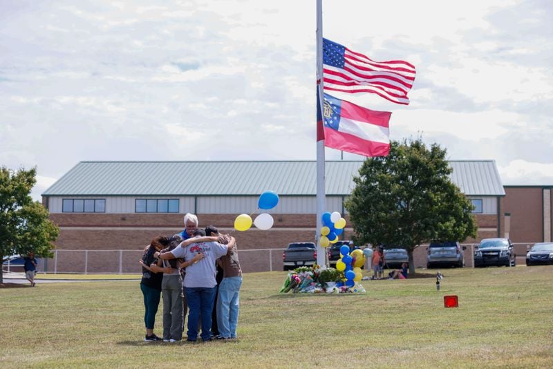 Al New from the Billy Graham rapid response team offered a prayer with the Mendoza Family from Winder, who came to pay respects to the victims at Apalachee High School on Thursday, September 5, 2024. A day after, a 14-year-old opened fire at a Barrow County high school on Wednesday morning, killing two students and two teachers and injuring nine others.
(Miguel Martinez/AJC)
