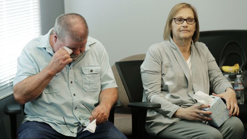 Chris Galvin, left, wipes his eyes as he sits with his wife Kathy, at a news conference Tuesday, May 7, 2019, in Seattle, regarding the 1967 slaying of his sister, Susan Galvin. The 20-year-old police records clerk was found raped and strangled in a parking garage elevator at the Seattle Center on July 9, 1967, after she failed to show up for work. Seattle cold case detectives on Tuesday, May 7, 2019, announced that DNA evidence from clothes worn by Galvin when she died has been linked to the genetic profile of Frank Wypych, who was a 26-year-old security guard when Galvin was killed. Wypych died of diabetes complications in 1987.