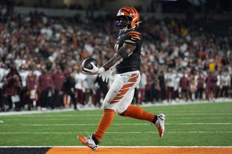 Cincinnati Bengals running back Zack Moss scores on a 1-yard touchdown run during the second half of an NFL football game against the Washington Commanders, Monday, Sept. 23, 2024, in Cincinnati. (AP Photo/Carolyn Kaster)