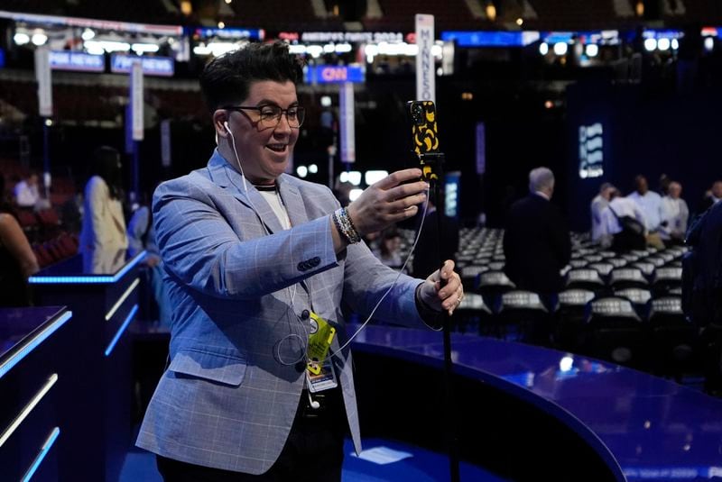 Social media influencer "V" Spehar is seen on the convention floor before the Democratic National Convention Monday, Aug. 19, 2024, in Chicago. (AP Photo/Brynn Anderson)