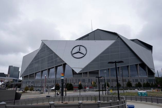 The exterior of the Mercedes-Benz Stadium in Atlanta is shown Friday afternoon, Sept. 17, 2021 in Atlanta.  Officials were touring the stadium Friday as part of the FIFA World Cup 2026 Candidate Host City Tour. (AP Photo/Ben Gray)