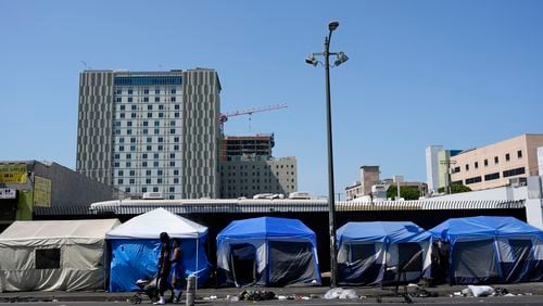 Tents are lined up on Skid Row Thursday, July 25, 2024, in Los Angeles. California Gov. Gavin Newsom issued an executive order Thursday to direct state agencies on how to remove homeless encampments, a month after a Supreme Court ruling allowing cities to enforce bans on sleeping outside in public spaces. (AP Photo/Jae C. Hong)