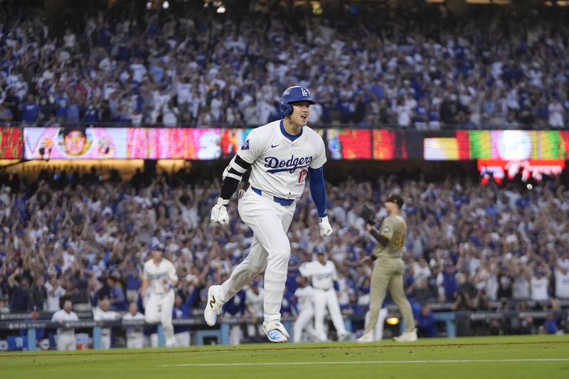 Los Angeles Dodgers' Shohei Ohtani reacts as he rounds first base following his three-run home run during the second inning in Game 1 of baseball's NL Division Series against the San Diego Padres, Saturday, Oct. 5, 2024, in Los Angeles. (AP Photo/Mark J. Terrill)