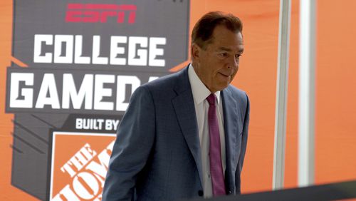 ESPN football analyst Nick Saban walks to the stage of College Game Day outside of Kyle Field on Saturday, Aug. 31, 2024, in College Station, Texas. (AP Photo/Sam Craft)