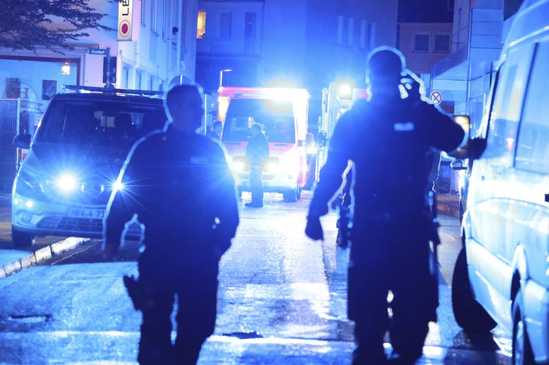 Police and ambulances near the scene where people were killed and injured in an attack at a festival in Solingen, western Germany, the German dpa news agency reported, Friday, Aug. 23, 2024. (Gianni Gattus/dpa via AP)