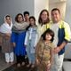 Arif Safi, far right, poses with his wife Zainab, second from left, the couple's four children, and Jennifer Glasse on the Afghan's family first full day in metro Atlanta, Wednesday, September 11, 2024.