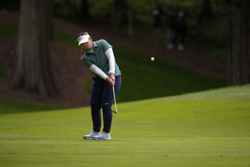 Caroline Inglis hits on to the 14th green during the final round of the Women's PGA Championship golf tournament at Sahalee Country Club, Sunday, June 23, 2024, in Sammamish, Wash. (AP Photo/Lindsey Wasson)
