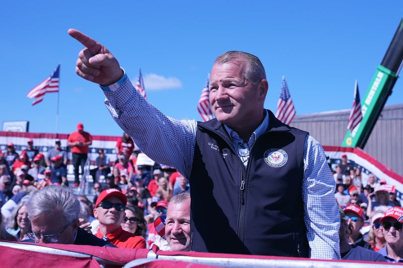 Rep. Troy Nehls, R-Texas, gestures as Republican presidential nominee former President Donald Trump speaks during a campaign event at Central Wisconsin Airport, Saturday, Sept. 7, 2024, in Mosinee, Wis. (AP Photo/Alex Brandon)