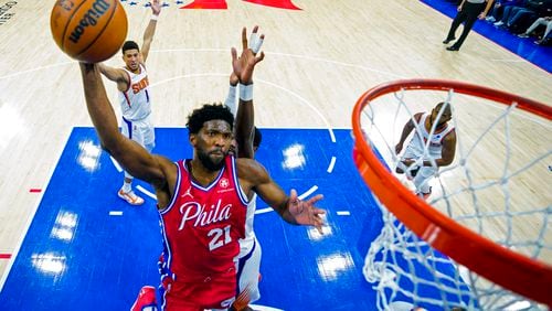 FILE - Philadelphia 76ers' Joel Embiid goes up for the dunk during the second half of an NBA basketball game against the Phoenix Suns, Tuesday, Feb. 8, 2022, in Philadelphia. (AP Photo/Chris Szagola, File)