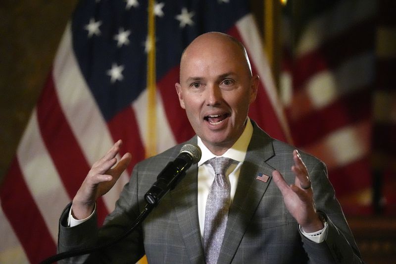 FILE - Utah Gov. Spencer Cox speaks during a news briefing on March 1, 2024, in Salt Lake City. Cox is also set to face his primary challenger, state Rep. Phil Lyman, on Tuesday, June 25, 2024. Cox, the moderate Republican, who took office in 2021, is expected to win among primary voters even after he was booed earlier this year by GOP convention delegates, who tend to lean farther right. (AP Photo/Rick Bowmer, File)