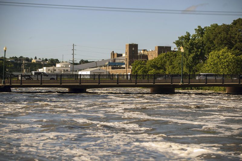 Falls Park is submerged in floodwaters after days of heavy rain led to flooding in the area, Saturday, June 22, 2024, in Sioux Falls, S.D. (AP Photo/Josh Jurgens)