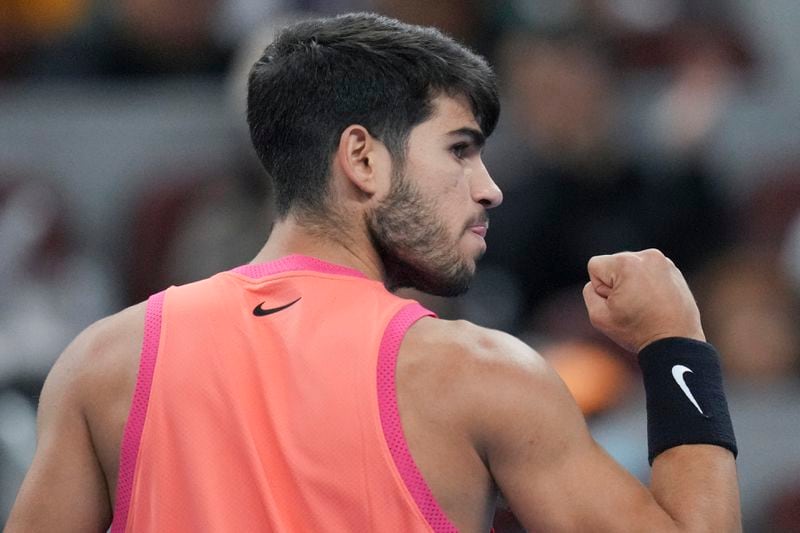 Carlos Alcaraz of Spain gestures during their men's singles finals match against Jannik Sinner of Italy at the China Open tennis tournament, National Tennis Center in Beijing, Wednesday, Oct. 2, 2024. (AP Photo/Achmad Ibrahim)