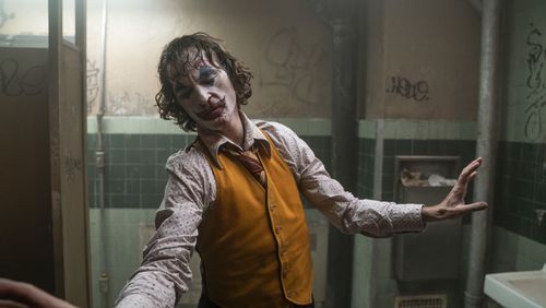 This image released by Warner Bros. Pictures shows Joaquin Phoenix in a scene from "Joker." (Niko Tavernise/Warner Bros. Pictures via AP)