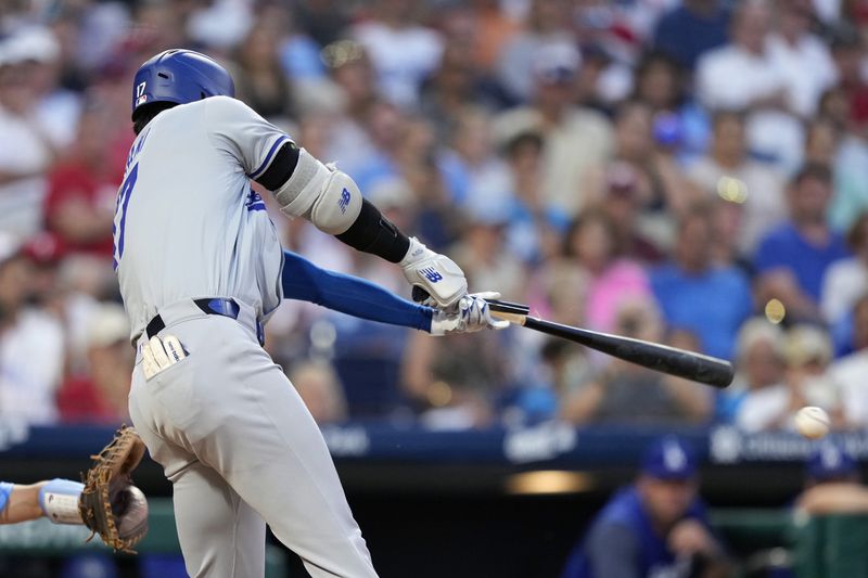 Los Angeles Dodgers' Shohei Ohtani breaks his bat on a ground out against Philadelphia Phillies pitcher Matt Strahm during the seventh inning of a baseball game, Thursday, July 11, 2024, in Philadelphia. (AP Photo/Matt Slocum)