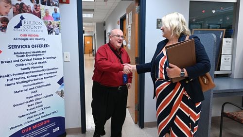 Dwayne Givens, Workforce Development Director, shakes hands with candidate Amy McEver after interviewing her during Fulton County Board of Health Career Fair at North Fulton Regional Health Center on Tuesday in Alpharetta. (Hyosub Shin / Hyosub.Shin@ajc.com)