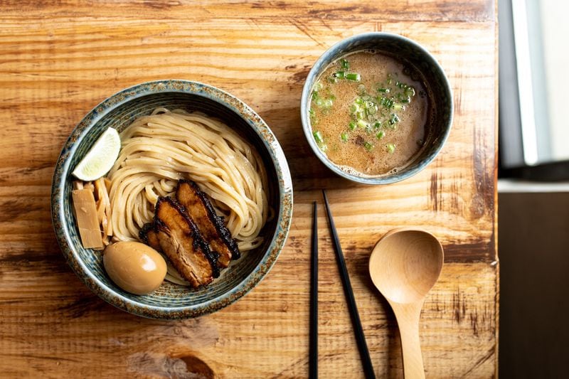 Buta Paitan with Gyokai Tsukemen, rich chicken and fish broth, pork chashu, soft boiled egg, bamboo shoots, yuzu zest, scallion, lime, and thick noodles. Photo credit- Mia Yakel.