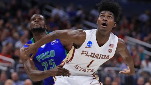 ORLANDO, FL - MARCH 16:  Marc-Eddy Norelia #25 of the Florida Gulf Coast Eagles and Jonathan Isaac #1 of the Florida State Seminoles battle for position during a free throw in the first half during the first round of the 2017 NCAA Men's Basketball Tournament at Amway Center on March 16, 2017 in Orlando, Florida.  (Photo by Mike Ehrmann/Getty Images)