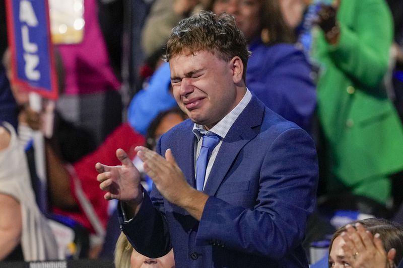 Gus Walz cries as Democratic vice presidential nominee Minnesota Gov. Tim Walz speaks during the Democratic National Convention Wednesday, Aug. 21, 2024, in Chicago. (AP Photo/Matt Rourke)