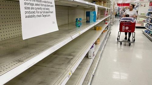 A woman shops for baby formula at Target in Annapolis, Maryland, on May 16, 2022, as a nationwide shortage of baby formula continues due to supply chain crunches tied to the coronavirus pandemic that have already strained the country's formula stock, an issue that was further exacerbated by a major product recall in February. (Jim Watson/AFP via Getty Images/TNS)