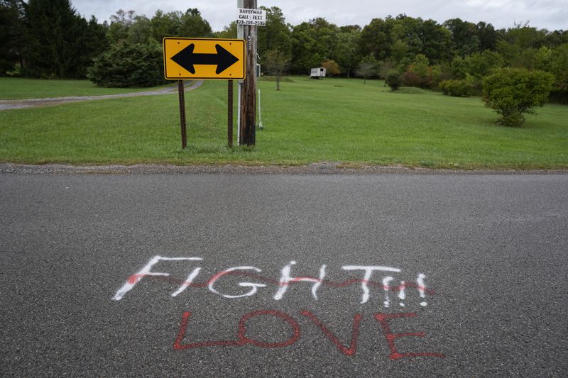 Show in graffiti in the area of the Butler Farm Show, the sight of an assassination attempt against Republican presidential nominee former President Donald Trump in Butler, Saturday, Sept. 28, 2024. (AP Photo/Matt Rourke)