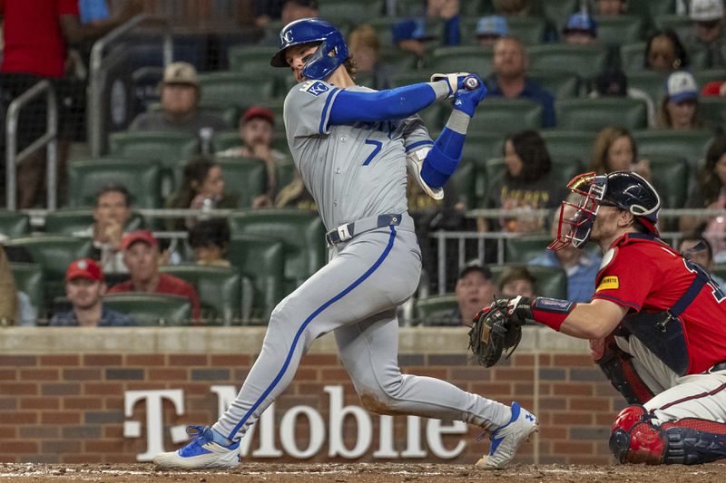 Kansas City Royals' Bobby Witt Jr. swings and hits a ball foul in the seventh inning of a baseball game against the Kansas City Royals, Friday, Sept. 27, 2024, in Atlanta. (AP Photo/Jason Allen)