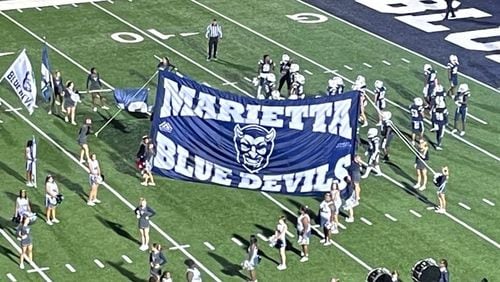 Marietta players prepare to take the field for their game against Harrison at Northcutt Stadium on Oct. 28, 2022. Marietta won 31-7 to remain in first place in Region 3-7A.