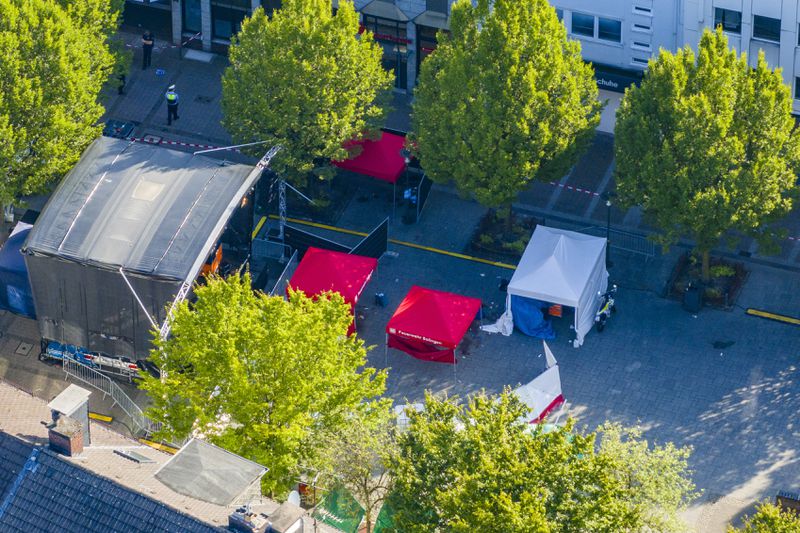 Emergency services tents stand in front of the stage in Solingen city center, Germany, Saturday Aug. 24, 2024, after three people were killed and at least eight people were wounded in a knife attack Friday night at the festival. (Christoph Reichwein/dpa via AP)