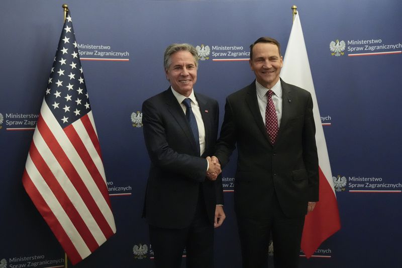 U.S. Secretary of State Antony Blinken, left, welcomes by Polish Foreign Minister Radosław Sikorski, right, for talks in Warsaw, Poland, Thursday, Sept. 12, 2024. (AP Photo/Mark Schiefelbein, Pool)