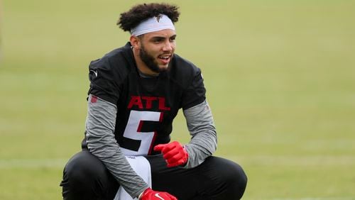 Atlanta Falcons wide receiver Drake London (5) talks with a teammate during minicamp at the Atlanta Falcons Training Camp, Tuesday, May 14, 2024, in Flowery Branch, Ga. (Jason Getz / AJC)
