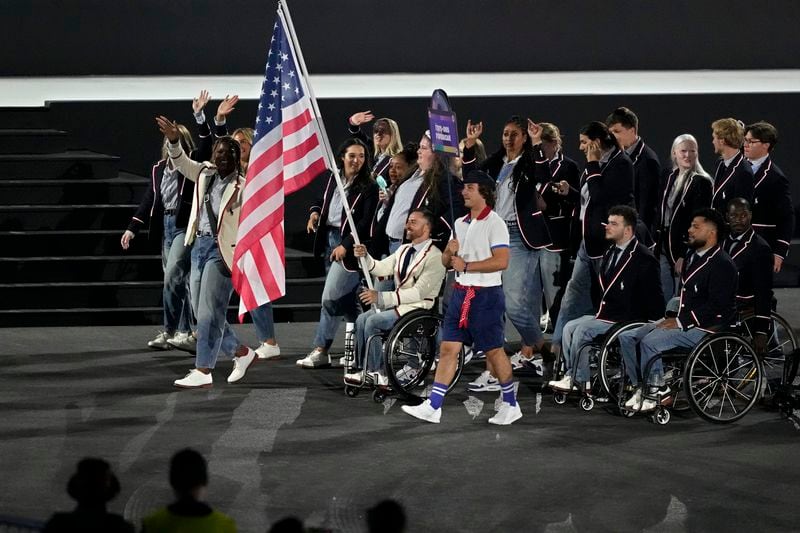 The United States athletes parade during the Opening Ceremony for the 2024 Paralympics, Wednesday, Aug. 28, 2024, in Paris, France. (AP Photo/Michel Euler)