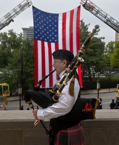 Tom Crawford of the Atlanta Pipe Band plays the bagpipe at the Cathedral of Christ the King located at 2699 Peachtree Road NE in Buckhead for the Annual Blue Mass honoring safety officials and first responders. Atlanta Mayor Andre Dickens along with Atlanta Rescue Fire and Atlanta Police were in attendance to join parishioners and members of the public to pray and show appreciation for those who serve and protect the public in observance of 9-11.