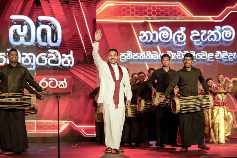 FILE - Presidential candidate Namal Rajapaksa, elder son of former president Mahinda Rajapaksa waves during the launching of his election manifesto in Colombo, Sri Lanka, Monday, Sept. 2, 2024. (AP Photo/Eranga Jayawardena, File)