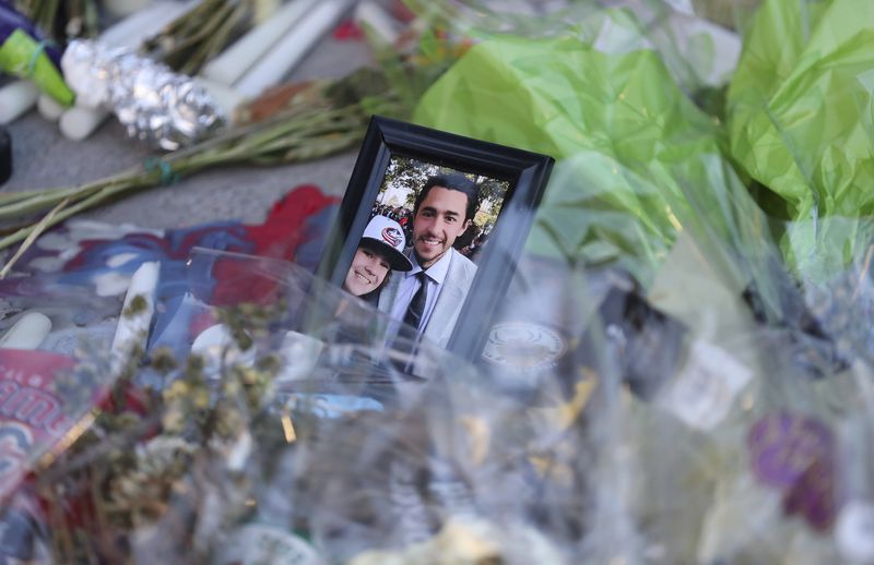 Fans leave mementos as part of the candlelight vigil to honor Columbus Blue Jackets hockey player Johnny Gaudreau, Thursday, Sept. 4, 2024, outside of Nationwide Arena in Columbus, Ohio. Gaudreau and his brother Matthew were killed by a motor vehicle last week while riding bicycles. (AP Photo/Joe Maiorana)