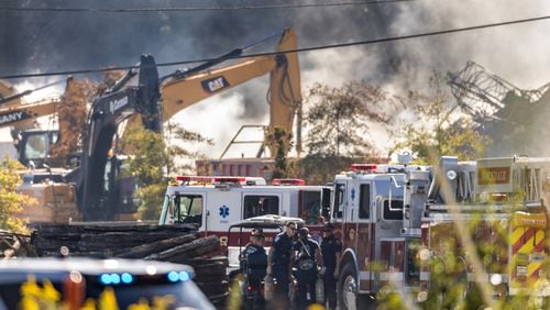 BioLab was still smoldering at mid-morning Wednesday, Oct 2, 2024 as a large mile-long plume was still visible over Conyers as crews worked at the plant that caught on fire days earlier. But as the sun lifted above the horizon, so did the shelter-in-place order for Rockdale County residents. Those living nearby have been advised to stay inside every evening through early morning until Friday. (John Spink/AJC)