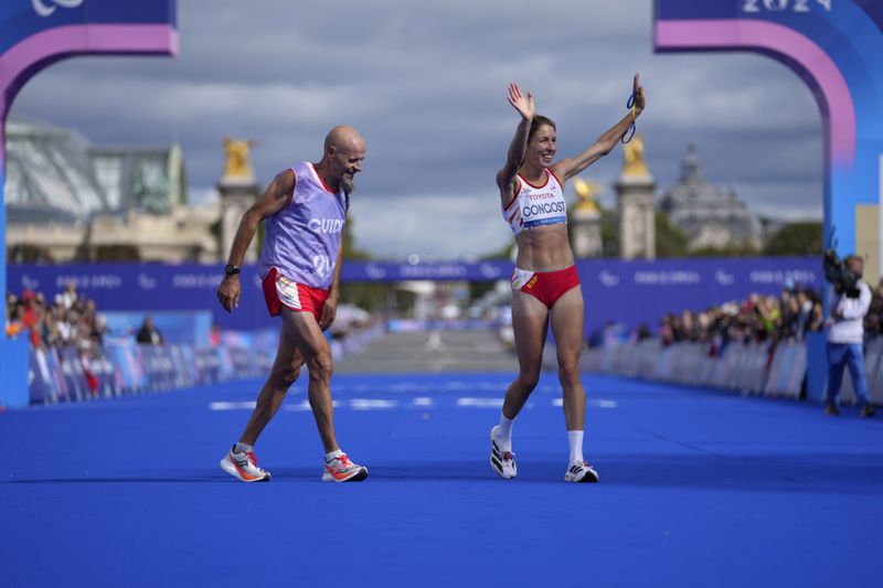 Spain's Elena Congost celebrates after winning the bronze medal in the women's marathon T12 at the 2024 Paralympics, Sunday, Sept. 8, 2024, in Paris, France. (AP Photo/Thibault Camus)