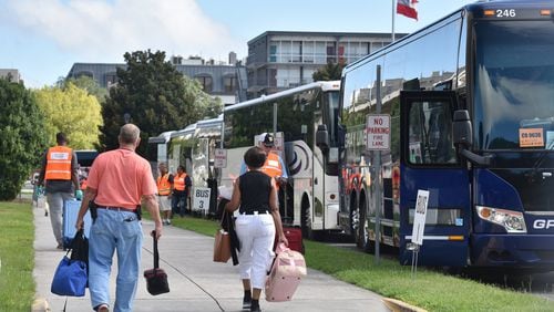 Under mandatory evacuation ahead of Hurricane Dorian, hundreds of local residents get on buses outside the Savannah Civic Center for free transportation to an inland shelter on Sept. 3. Chatham Area Transit (CAT) provided free transportation to residents without private transportation to the Savannah Civic Center to assist in the mandatory evacuation of Chatham County. HYOSUB SHIN / HYOSUB.SHIN@AJC.COM