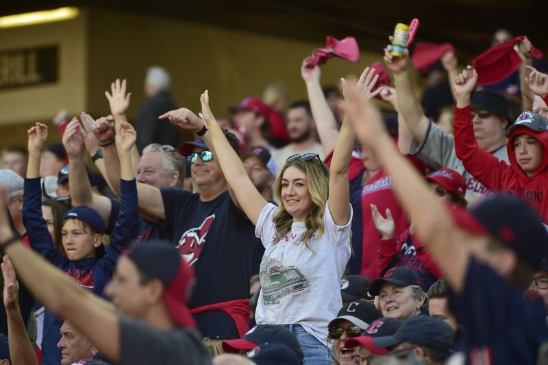 Fans cheer in the fifth inning during Game 1 of baseball's AL Division Series between the Detroit Tigers and the Cleveland Guardians, Saturday, Oct. 5, 2024, in Cleveland. (AP Photo/Phil Long)