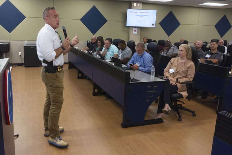 Chris Harvey, Deputy Executive Director of Georgia Peace Officers Standards and Training Council, speaks during an election security training session at Cobb County Emergency Management headquarters, Aug. 23, 2024, in Marietta. (AP Photo/John Bazemore)