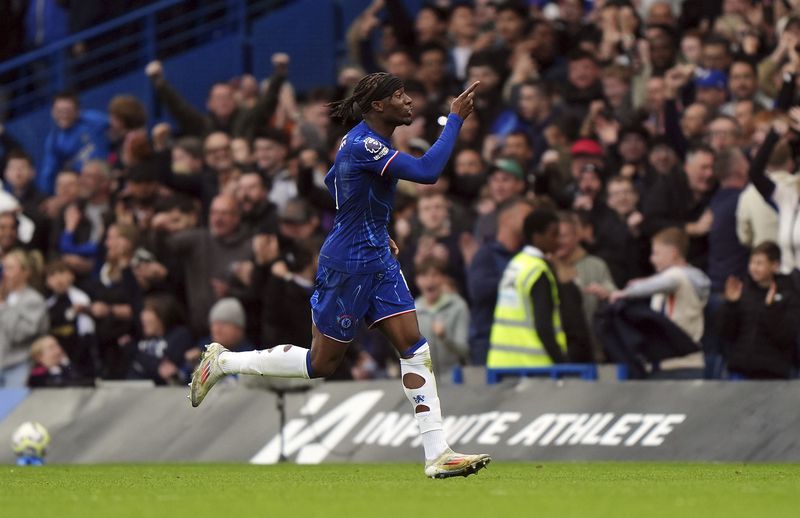 Chelsea's Noni Madueke celebrates scoring their side's first goal of the game during the English Premier League soccer match between Chelsea and Nottingham Forest at Stamford Bridge in London, Sunday Oct. 6, 2024. (Bradley Collyer/PA via AP)